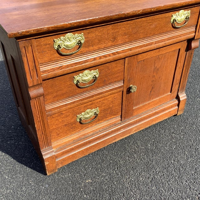A True East Lake Victorian Beauty. Solid brass stamped pulls, Full front ribbons, Feet, One large, 2 small drawers with 1...