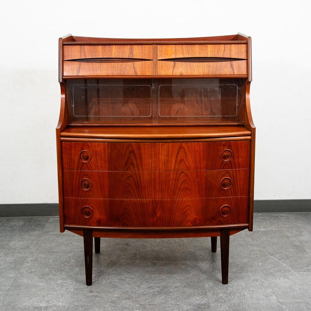 Outstanding Danish modern secretary desk in teak. Comes with sliding drawers and teak handles throughout + a slide out...