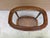 This is a vintage two tier oval end table featuring a glass top, wood frame, and a woven can lower shelf. Could be placed...