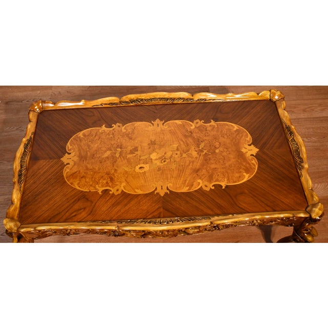 We are pleased to offer this beautiful Antique French coffee table, from the 1930s . This table is made of Walnut wood,...