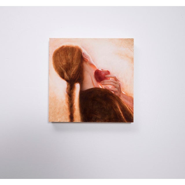 This artwork depicts a figure with long hair, their back turned and head tilted, delicately holding a red apple against...