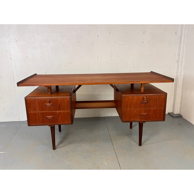 Vintage well made Danish Design Mid Century teak desk, 1950s Designed in the manner of Louis van Teeffelen for...
