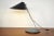 German design - desk lamp from the 1960s. - The lamp is made of chrome -plated and black painted metal. - The lampshade is...