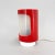Vintage table lamp made of plastic. The red part can be rotated to regulate the strength of the light. Up to 250V...