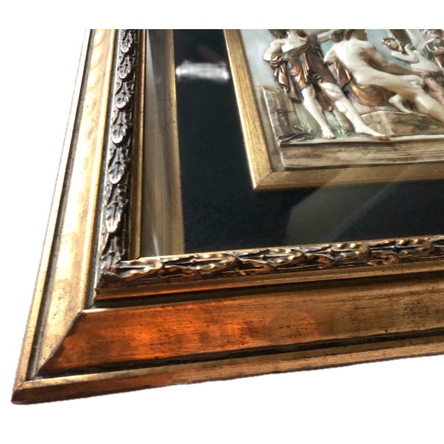 A finely executed early 20th-century classical-revival bas-relief wall plaque in white-bodied fired ceramic, presented in...