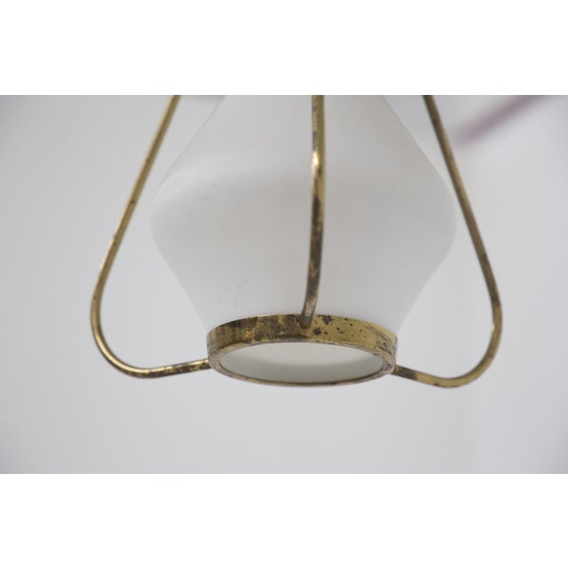 Pendant in Opaline Glass Brass from Stilnovo, 1960, in Very Good conditions. Designed 1960 to 1969 This piece is...