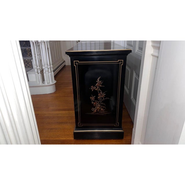 A refined chinoiserie bar cabinet by Drexel Heritage, combining classic Eastern-inspired motifs with tailored American...