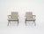 Black metal lounge chairs with new beige velvet upholstery. Designed by the Dutch Designer Friso Kramer for Ahrend de...