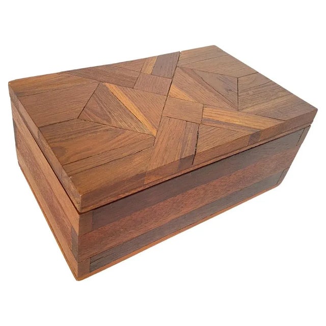 This box is a jewelry box or a decorative box. It was made in the 1970s, in France. Its lid is made of a checkerboard...