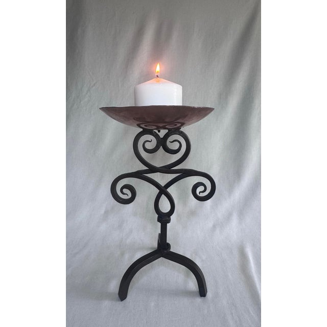 This Spanish Revival vintage candleholder is a well hand-crafted piece featuring wrought iron in an elaborate symmetrical...
