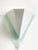 A vintage wall lamp / sconce by happy light, featuring a geometric postmodern design in white metal and pale green...
