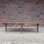 This is a beautiful professionally refinished walnut coffee table. It features an oval or surfboard shape, timeless design...