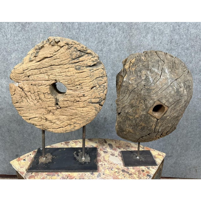 Two very old wooden pulley wheels mounted on iron bases Beautiful decorative pieces H 55 x W 39 x D 15 cm