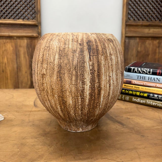 "About This Piece About This Piece Bring the raw beauty of nature indoors with this striking ceramic vase, a piece that...