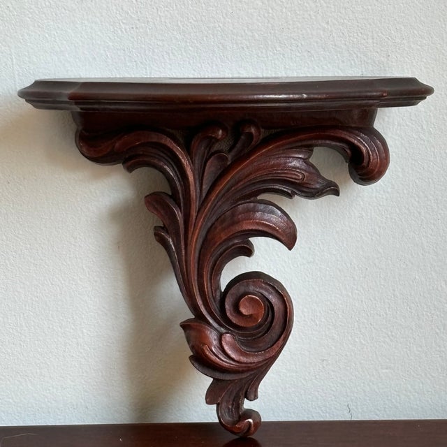 A gorgeous mid-20th century carved wood wall bracket in the French Rococo style. Love the scrolling acanthus design....