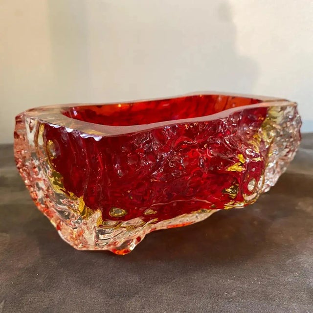 A red sommerso murano glass bowl designed and manufactured in Venice in the Seventies by Mandruzzato. It's in lovely...