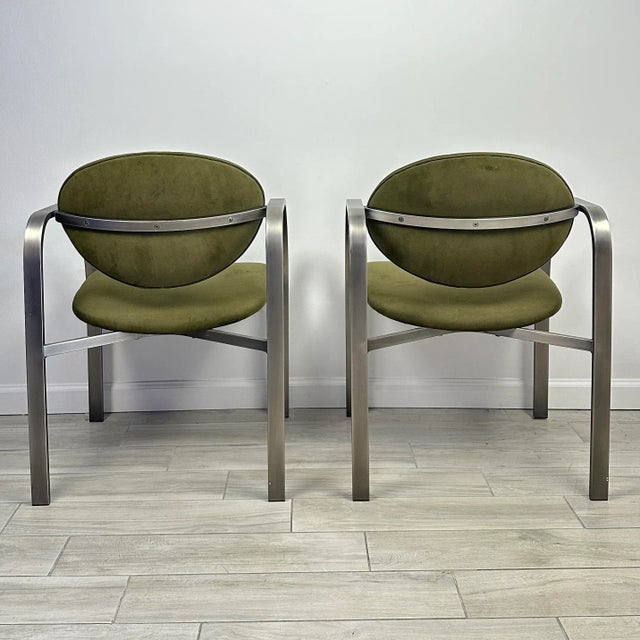 Vintage circa 1990s DIA (Design Institute of America) postmodern side chairs. Brushed matte bent sculptural steel frames...