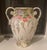 For sale is a large ceramic floor vase that measures 16 inches in height. This vase is designed as an urn, with 2 handles,...