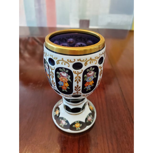 A unique deep royal purple amethyst crystal overlay moser goblet. Having rich raised gold enamel hand painted milleflori...