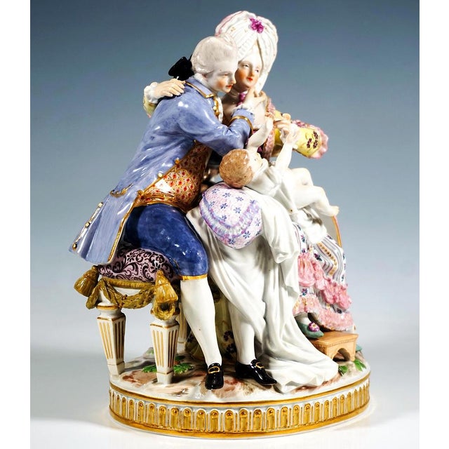 Exceptional meissen porcelain group of the 19th century: young mother in elaborate rococo house dress: ruched wide long...