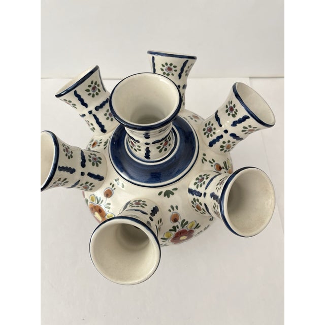 Celebrate the beauty of traditional Dutch pottery with this stunning vintage Delft polychrome tulipiere vase. Featuring...