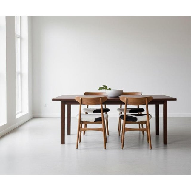 Set of four iconic CH30 dining chairs, designed by Hans J. Wegner and produced by Carl Hansen & Søn, Denmark, in 1952. A...