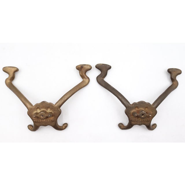 Victorian style hall tree hooks made of brass with a patina finish. The original mounting hardware is not available. Good...