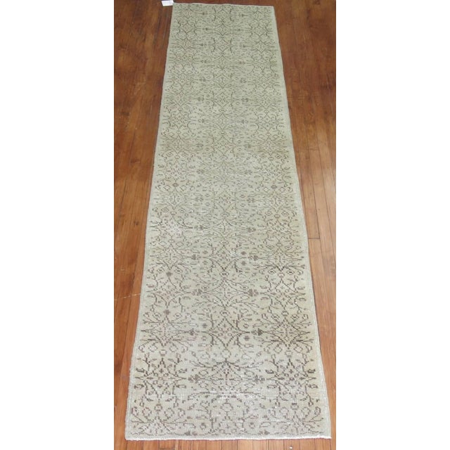 Neutral tone one of a kind Turkish runner with a borderless all over design, circa mid-20th century Measures: 2'7” x 11'9”.