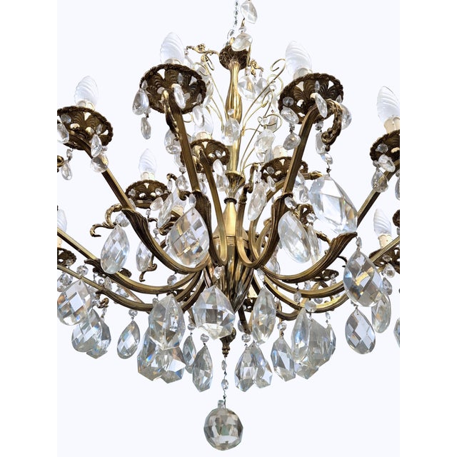 An elegant and dramatic chandelier in the authentic King Umberto of Savoy style, crafted from finely crafted bronze and...