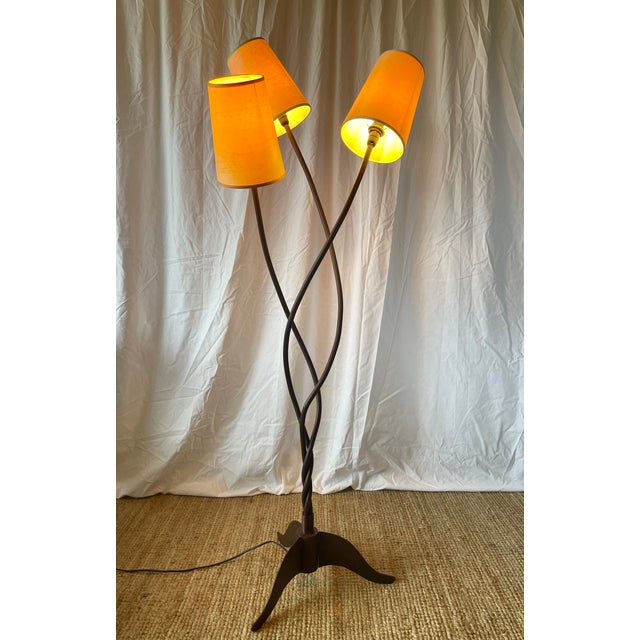 Three-arm wrought iron floor lamp by the French craftsman and manufacturer François Liguori. This artist, working from his...