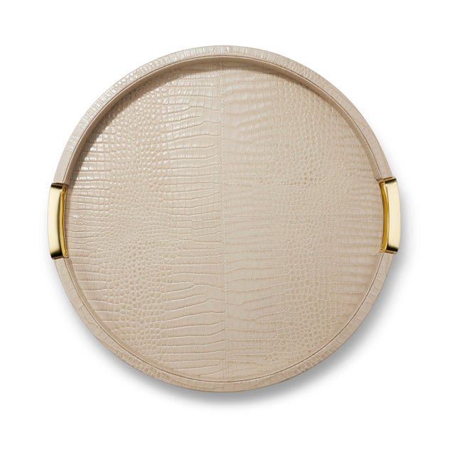 This circular tray in Italian Faux Croc Embossed Leather is enhanced by two rectangular integrated handles made of brass,...