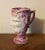 Antique 19th century English pink luster satyr head mug with leaping frog inside. Wonderful mottled surface. Measures 4...
