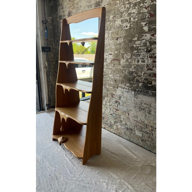 Turn your space into a sculptural statement with this extraordinary handcrafted wood shelf. Featuring organically carved...