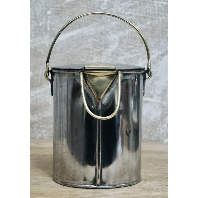 A superb antique milk can. Made from tin with brass fittings, marked ts.setterfield westgate on sea on the lid and the...