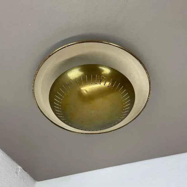 Article: brass ceiling light, also useable as wall light Origin: Italy Age: 1950s This vintage modernist light was...