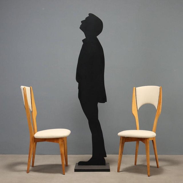 Set of six Italian-made dining chairs from the 1960s with beechwood frames, featuring elegant and sinuous lines typical of...