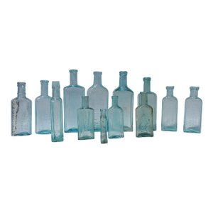 Set of 13 Late 19th Century Embossed Druggist/Pharmacy Bottles