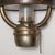 Vintage metal kerosene lantern with central glass shade retrofitted for electrified home use.