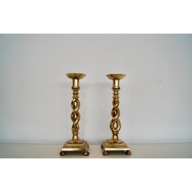 We have a pair of vintage Hollywood Regency candle sticks for sale. They are made of solid pure brass, and are in...