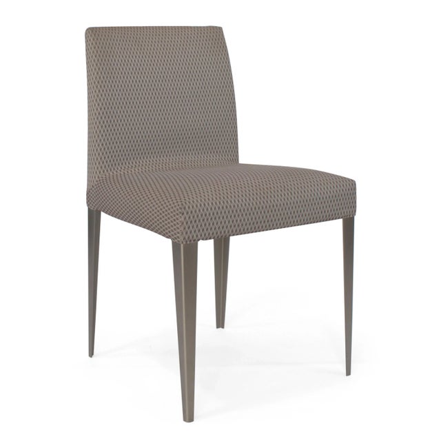 Set of four “Melandra” dining chairs designed by Antonio Citterio for B&B Italia. Minimalist in form, the chairs feature...