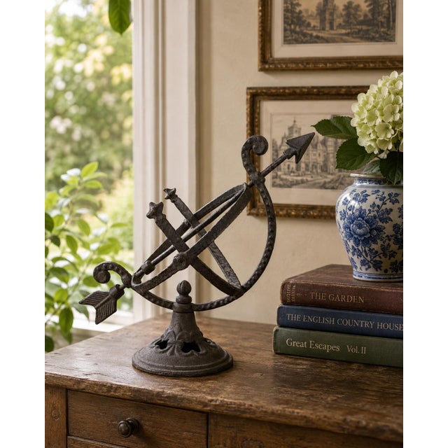 A beautifully crafted iron armillary half-sphere, evoking the timeless elegance of classical European gardens. Pieces like...