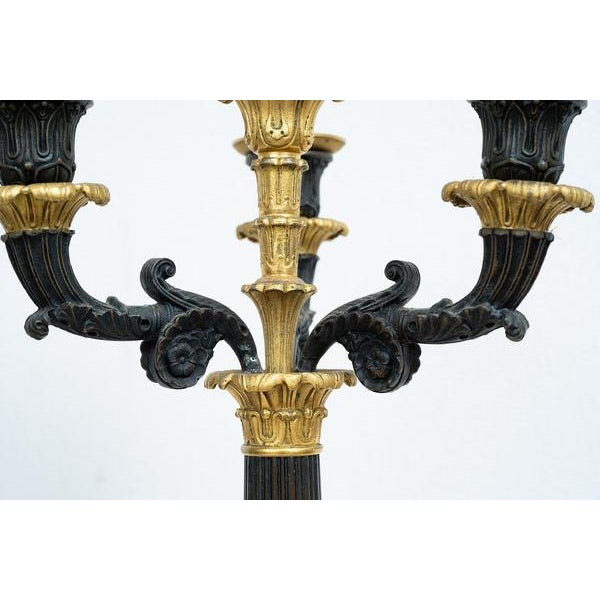 Pair of French gilt and burnished bronze Charles X candlesticks belonging to the second half of the 19th century. The...