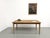 Maison Lecan presents this 1970s country table with an oak top resting on a pine base. Its highlight is the tabletop. A...
