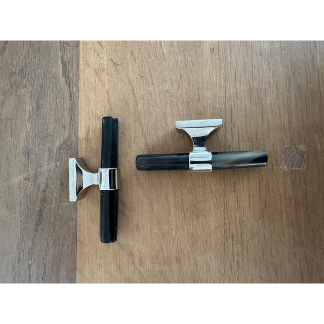 Set of small scale black horn pulls / handles from Ochre with polished nickel hardware. Variation in the horn can be seen...