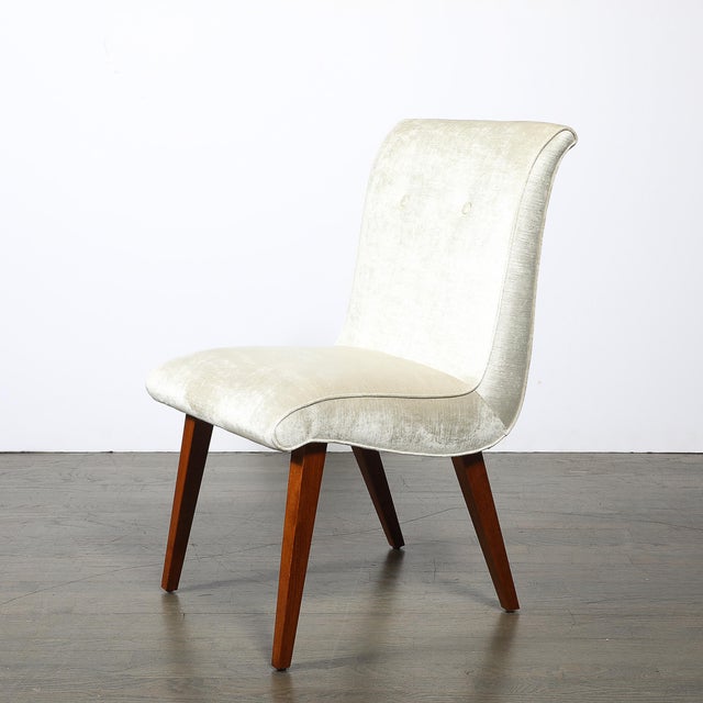 This Art Deco button-back chair by Russel Wright for the Conant Ball Company was crafted circa 1940, beautifully captures...