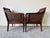 A charming pair of 1970’s Regency-style caned armchairs by Hickory Chair, beautifully crafted with faux bamboo carved...