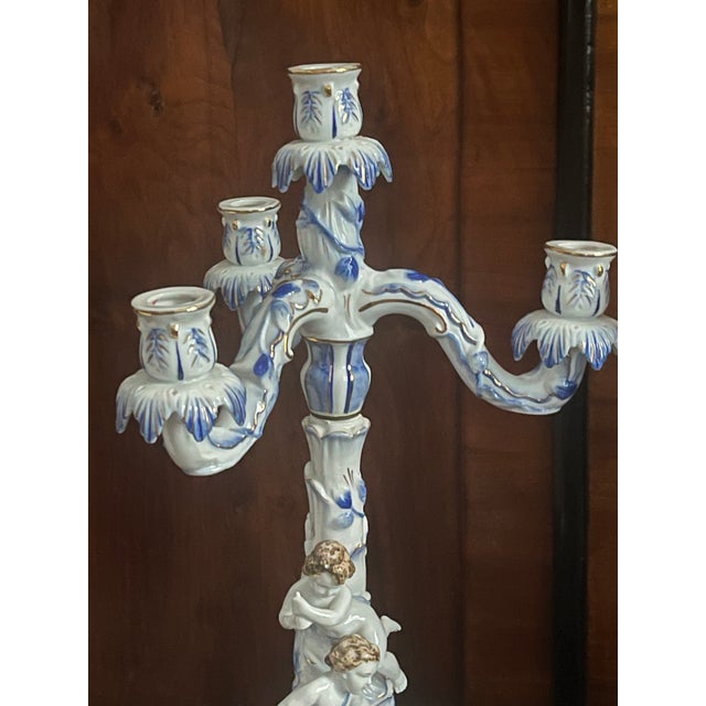 Gorgeous pair of vintage German Meisen style Blue Danube with putti figurines 3 arms candleholders in two parts.