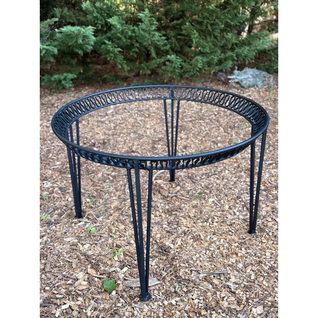 A rare and collectible piece of mid-century design history — this sculptural round dining table comes from the celebrated...