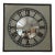 Restoration Hardware’s oversized iron framed wall mirror with a convex center and clock-face painted in bold, decorative...