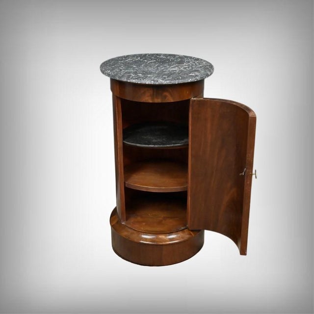 This mahogany veneer and solid mahogany nightstand immediately captivates with the nobility of its wood and the depth of...
